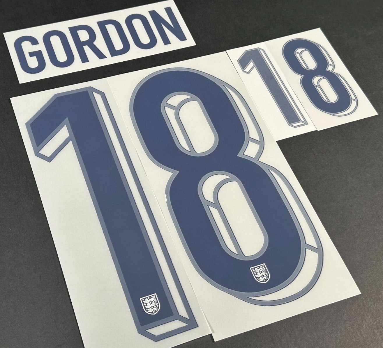 ENGLAND 2024-2025 OFFICIAL SPORTING ID GORDON 18 HOME PLAYER SIZE NAME SET