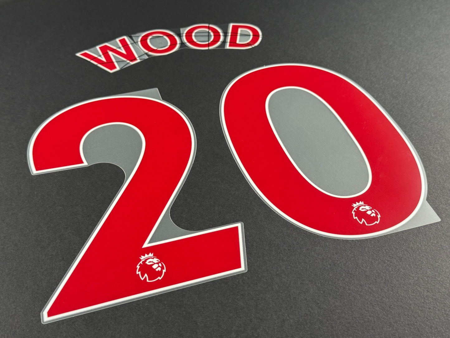 NEWCASTLE 2022-23 WOOD 20 OFFICIAL AVERY DENNISON RED PLAYER SIZE NAME SET