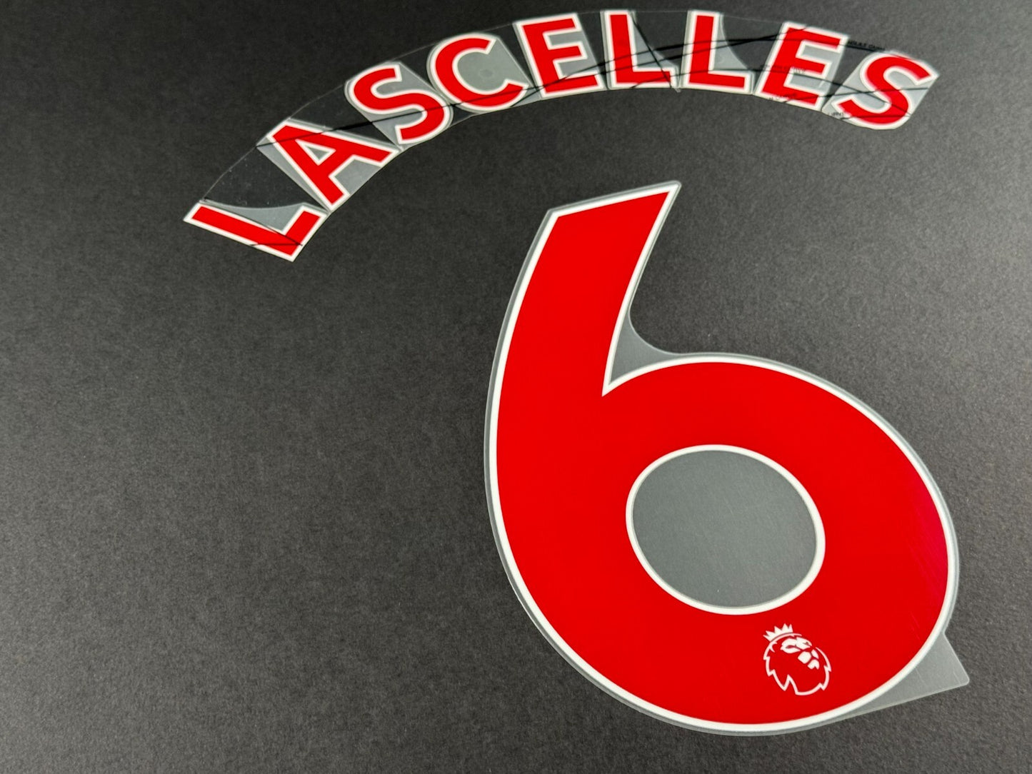 NEWCASTLE 2022-23 LASCELLES 6 OFFICIAL AVERY DENNISON RED PLAYER SIZE NAME SET