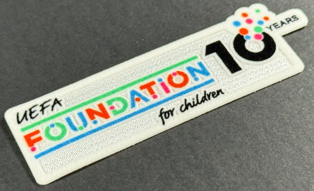 2025 / 2026 SPORTING ID UEFA FOUNDATION 10 YEARS PLAYER SLEEVE PATCH 100MM