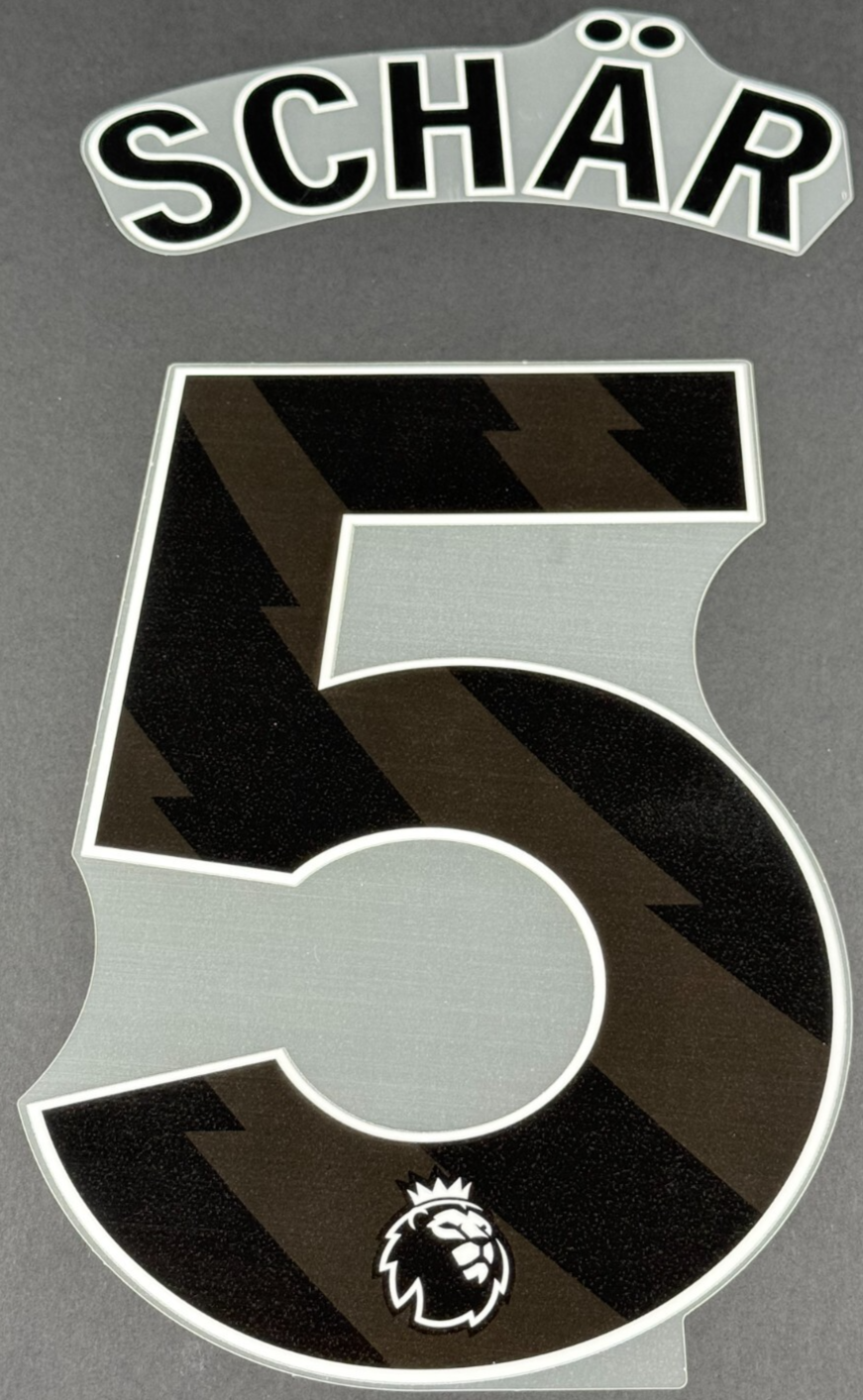 NEWCASTLE UNITED 24-25 SCHAR 5 OFFICIAL AVERY DENNISON BLACK PLAYER SIZE SET