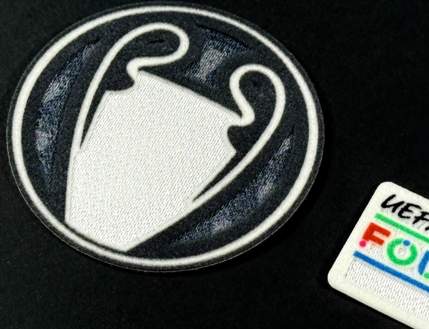 25 / 26 UEL TITLEHOLDER  SLEEVE PATCH + 10 YEARS UEFA FOUNDATION PATCH OFFICIAL