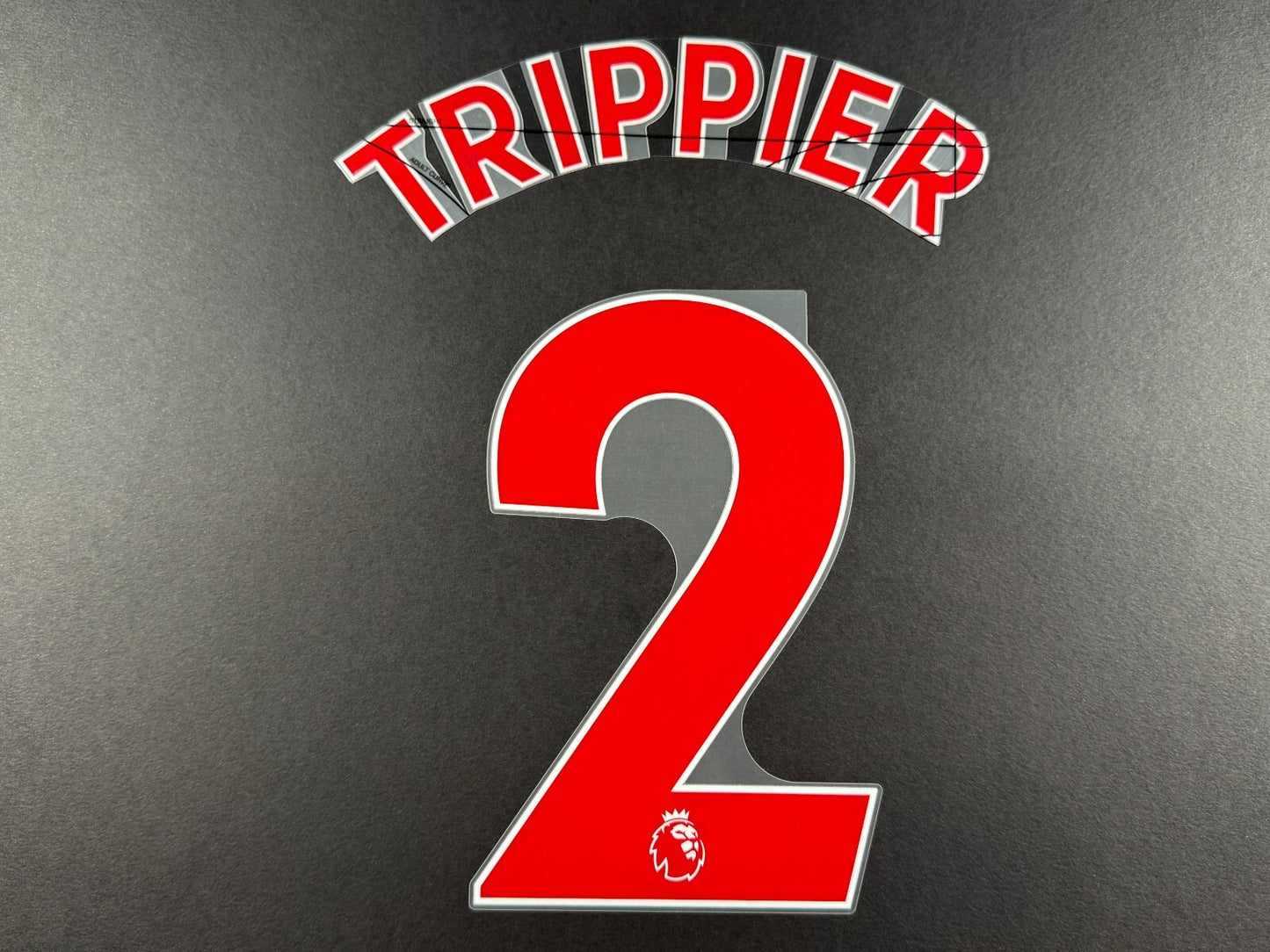 NEWCASTLE 2022-23 TRIPPIER 2 OFFICIAL AVERY DENNISON RED PLAYER SIZE NAME SET