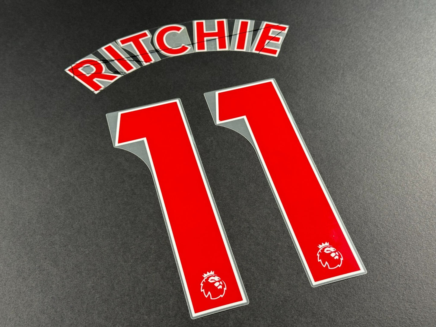 NEWCASTLE 2022-23 RITCHIE 11 OFFICIAL AVERY DENNISON RED PLAYER SIZE NAME SET