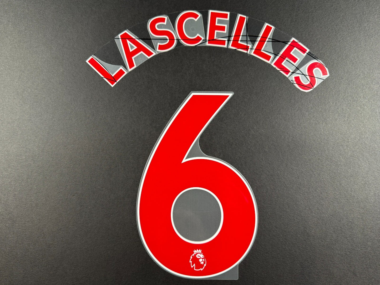NEWCASTLE 2022-23 LASCELLES 6 OFFICIAL AVERY DENNISON RED PLAYER SIZE NAME SET
