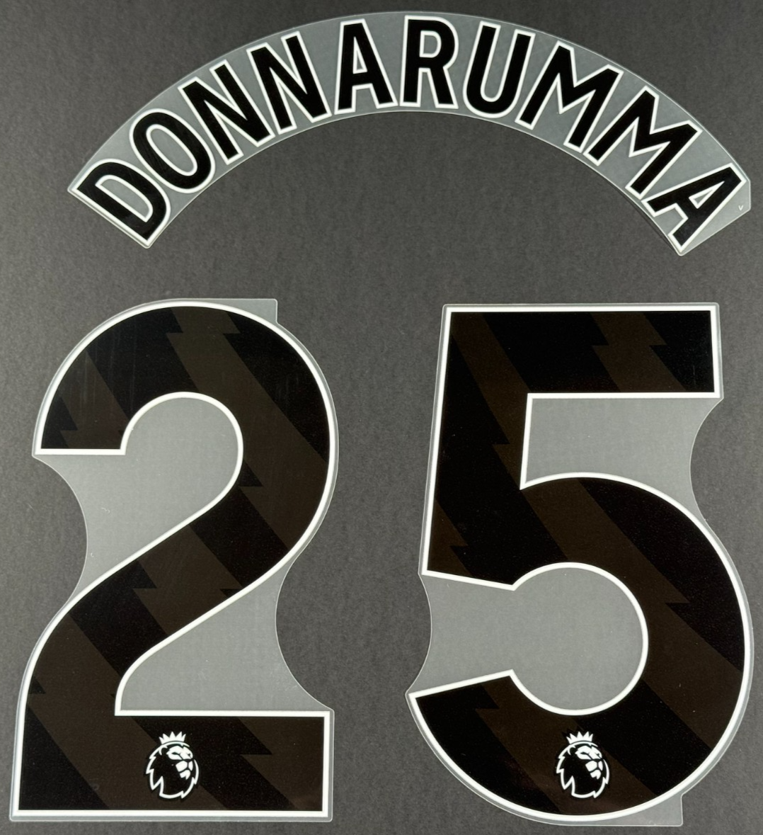 MAN CITY 25/26 DONNARUMMA 25 OFFICIAL AVERY DENNISON BLACK PLAYER SIZE NAME SET