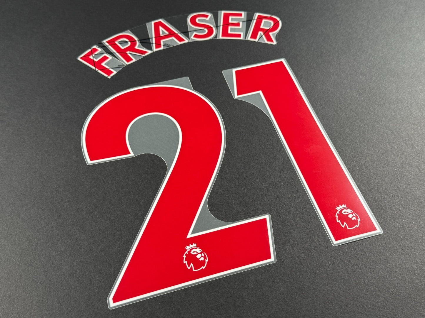 NEWCASTLE 2022-23 FRASER 21 OFFICIAL AVERY DENNISON RED PLAYER SIZE NAME SET