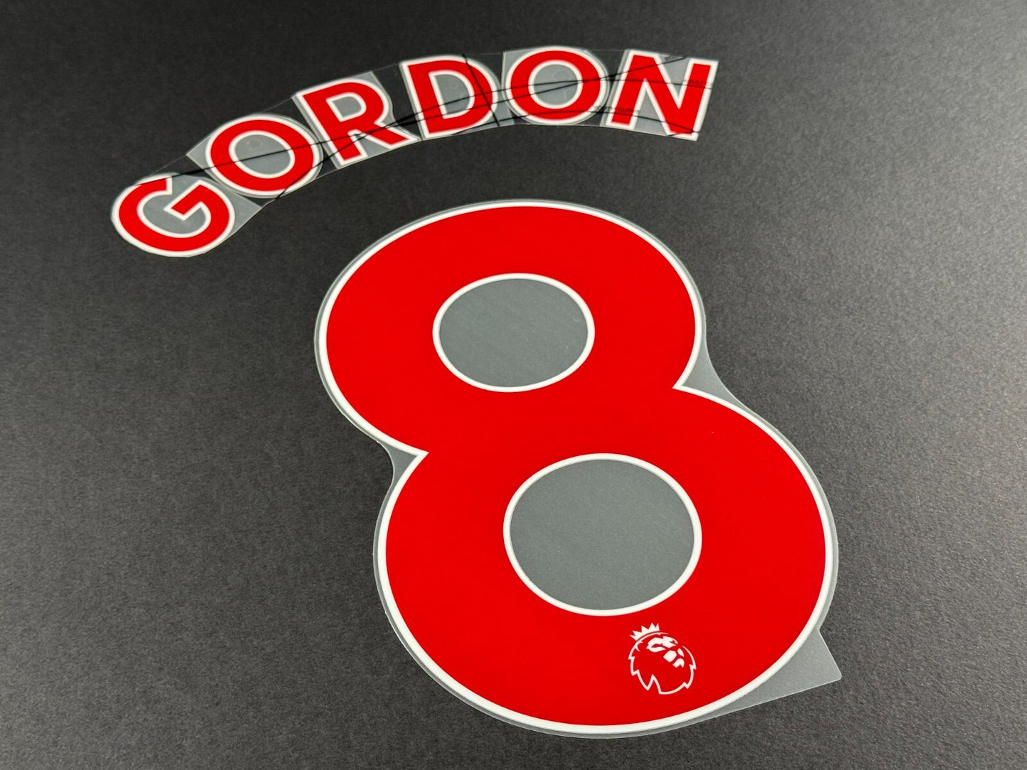 NEWCASTLE 2022-23 GORDON 8 OFFICIAL AVERY DENNISON RED PLAYER SIZE NAME SET