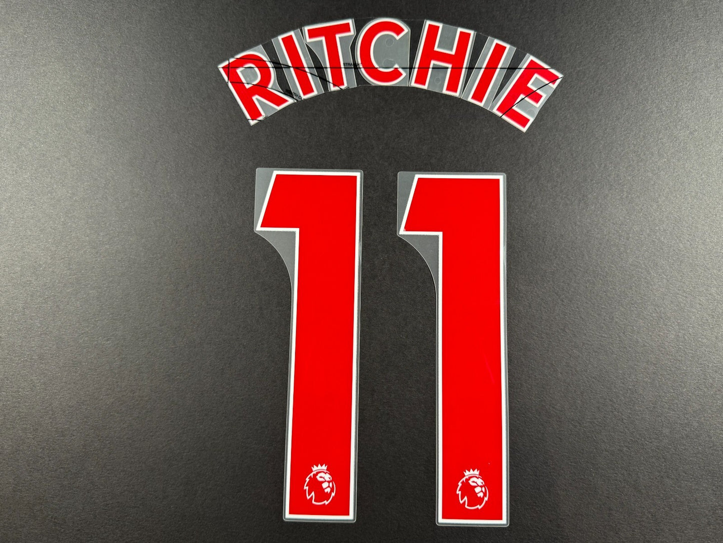 NEWCASTLE 2022-23 RITCHIE 11 OFFICIAL AVERY DENNISON RED PLAYER SIZE NAME SET