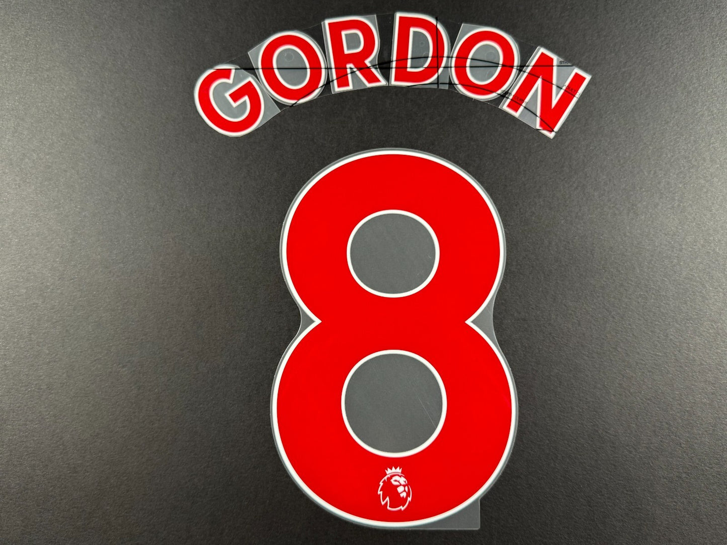 NEWCASTLE 2022-23 GORDON 8 OFFICIAL AVERY DENNISON RED PLAYER SIZE NAME SET