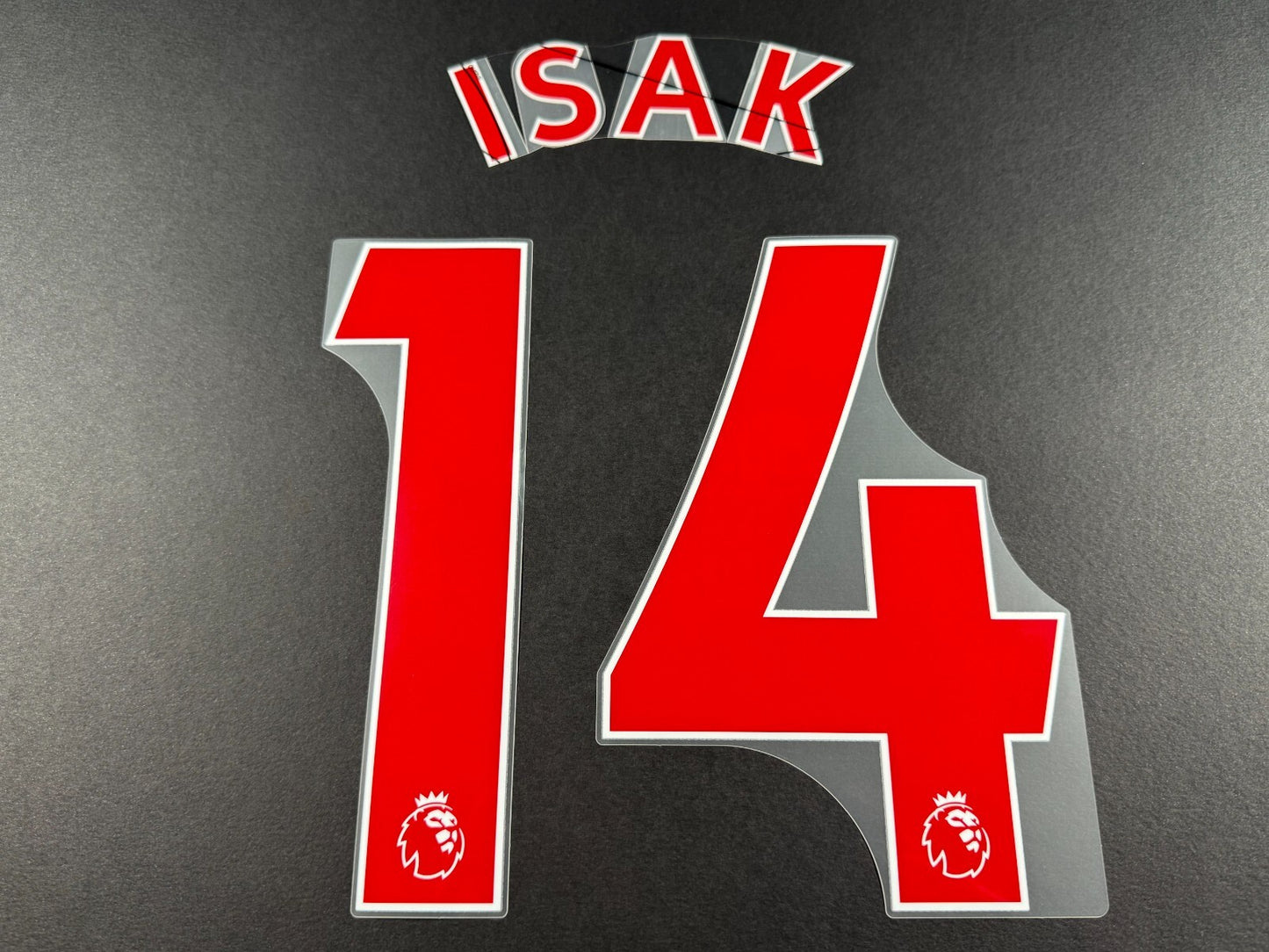NEWCASTLE 2022-23 ISAK 14 OFFICIAL AVERY DENNISON RED PLAYER SIZE NAME SET