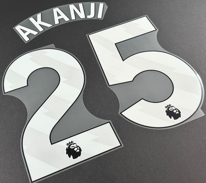 MAN CITY 2023/25 AKANJI 25 OFFICIAL AVERY DENNISON WHITE PLAYER SIZE NAME SET