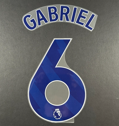 ARSENAL 2025 2026 GABRIEL 6 OFFICIAL AVERY DENNISON BLUE PLAYER SIZE NAMESET