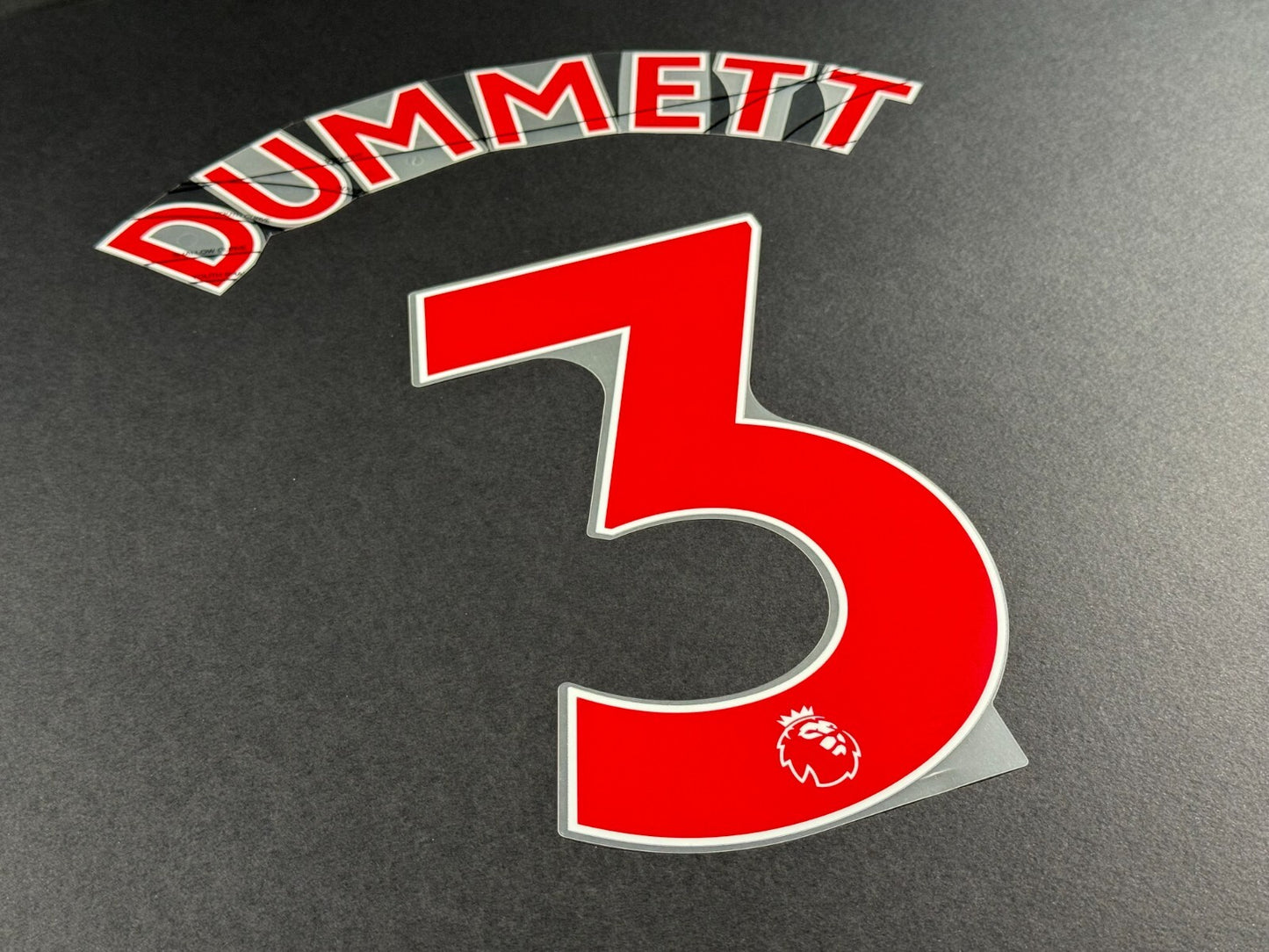 NEWCASTLE 2022-23 DUMMETT 3 OFFICIAL AVERY DENNISON RED PLAYER SIZE NAME SET