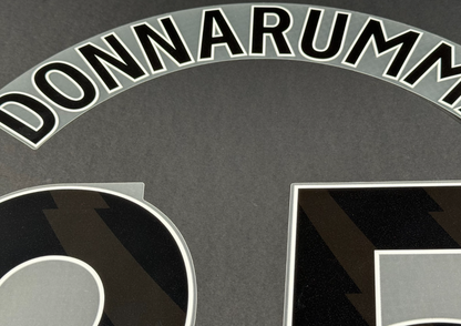MAN CITY 25/26 DONNARUMMA 25 OFFICIAL AVERY DENNISON BLACK PLAYER SIZE NAME SET