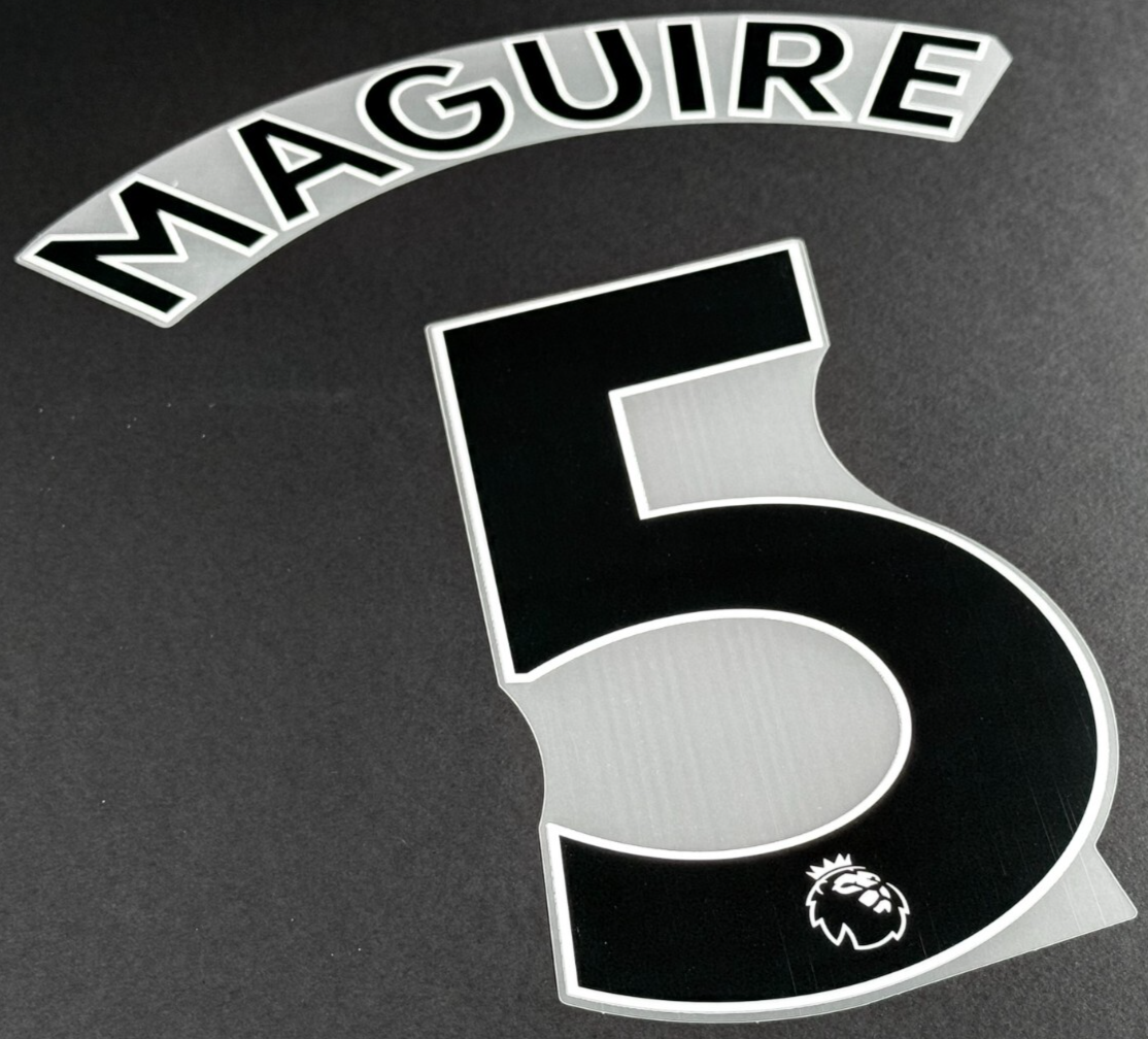 MAN UTD 1923/2023 MAGUIRE 5 OFFICIAL AVERY DENNISON BLACK PLAYER SIZE NAME SET